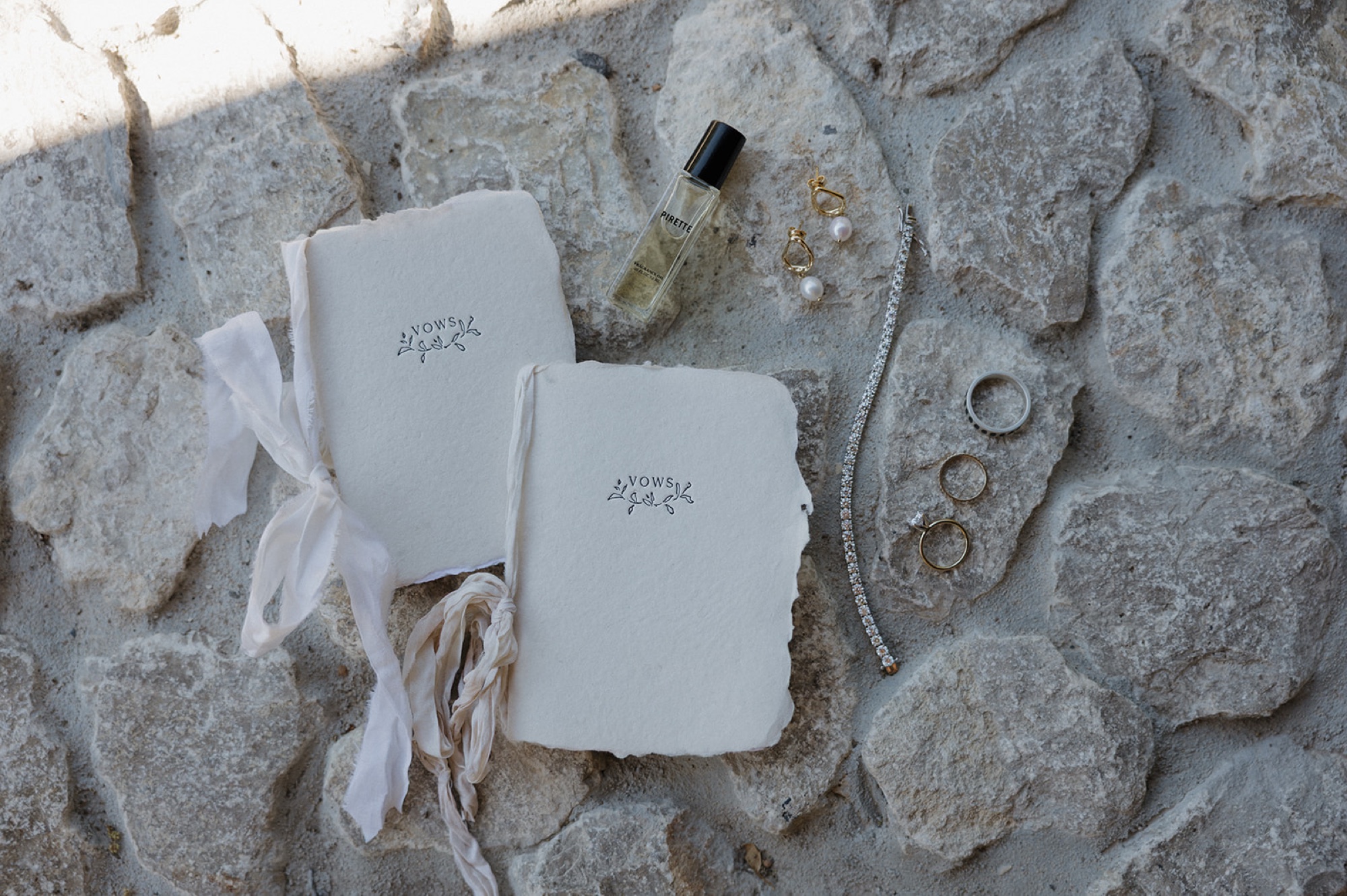 handwritten vow books; photos of wedding details
